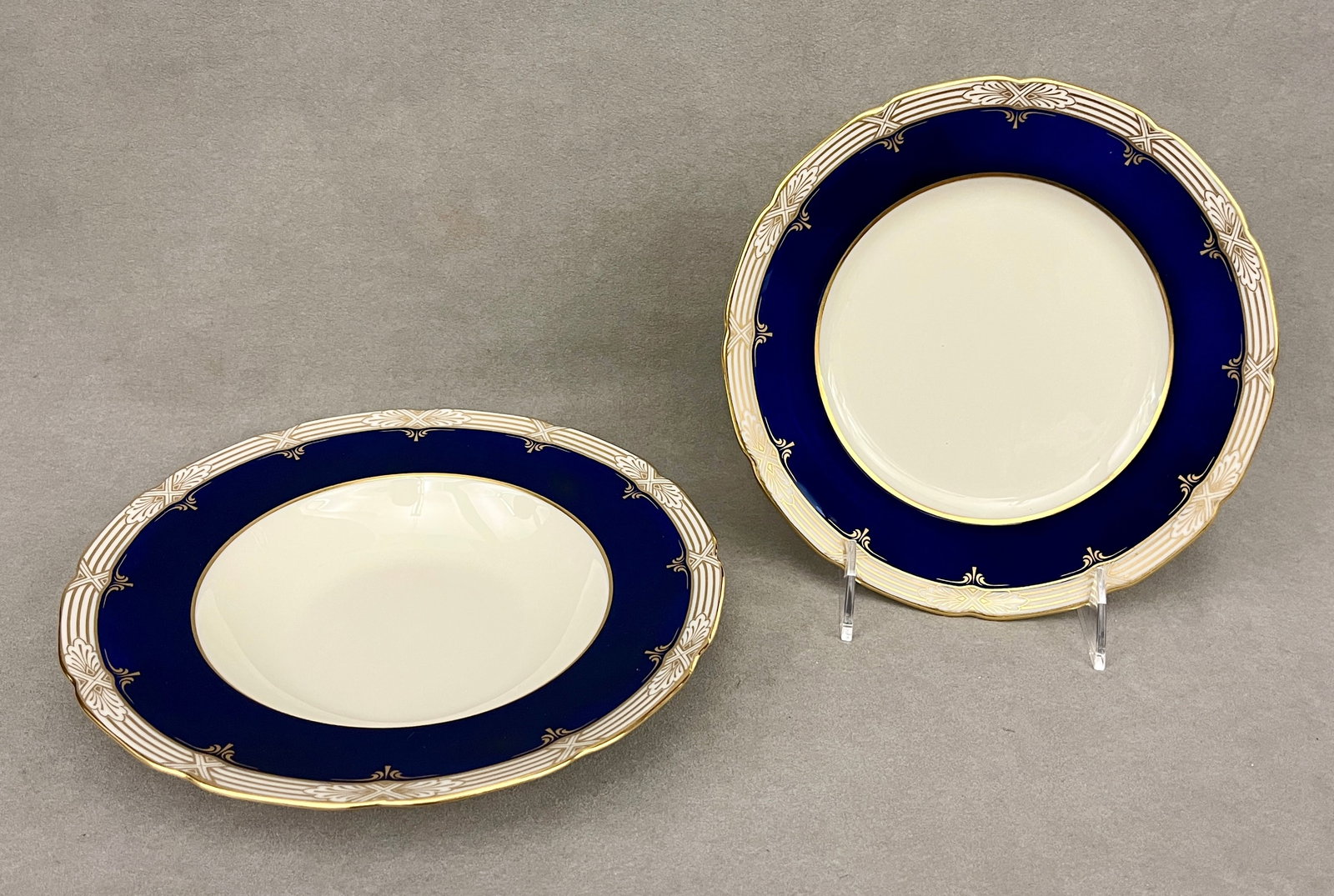 SET TWELVE LENOX COBALT AND GILT-BORDERED PORCELAIN SALAD/DESSERT PLATES WITH 12 MATCHING SOUP: SET TWELVE LENOX COBALT AND GILT-BORDERED PORCELAIN SALAD/DESSERT PLATES WITH 12 MATCHING SOUP PLATES Soup plates, D: 8 3/4 in.