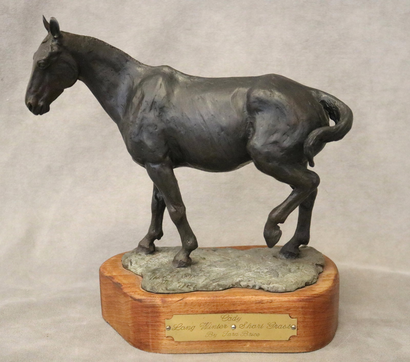 TARA BRICE (American, 20th century). Cody: Long Winter, Short Grass, 1983, Bronze, Height (including: TARA BRICE American, 20th century Cody: Long Winter, Short Grass, 1983 Bronze Limited edition sculpture of a standing horse, its head lowered resting after a long winter, mounted on a rectangular wood