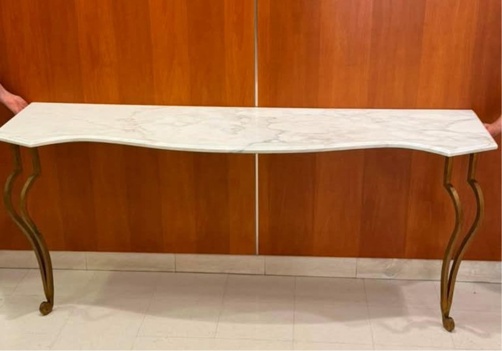CONTEMPORARY GILT-IRON CONSOLE TABLE WITH SHAPED GRAY-VEINED WHITE MARBLE TOP - H: 30 1/2 in. W: 71: CONTEMPORARY GILT-IRON CONSOLE TABLE WITH SHAPED GRAY-VEINED WHITE MARBLE TOP Top has serpentine front outline; scrolling legs. H: 30 1/2 in. W: 71 3/4 in. D: 20 in.