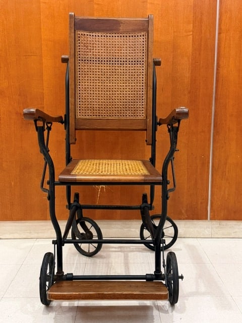 OAK AND IRON WHEELCHAIR WITH CANED BACK AND SEAT PANELS BY BLOCH-GO-CART COMPANY late 19th-early: OAK AND IRON WHEELCHAIR WITH CANED BACK AND SEAT PANELS BY BLOCH-GO-CART COMPANY late 19th-early 20th century Seat panels need recaning. Bloch/Made in U.S.A. label affixed to reverse
