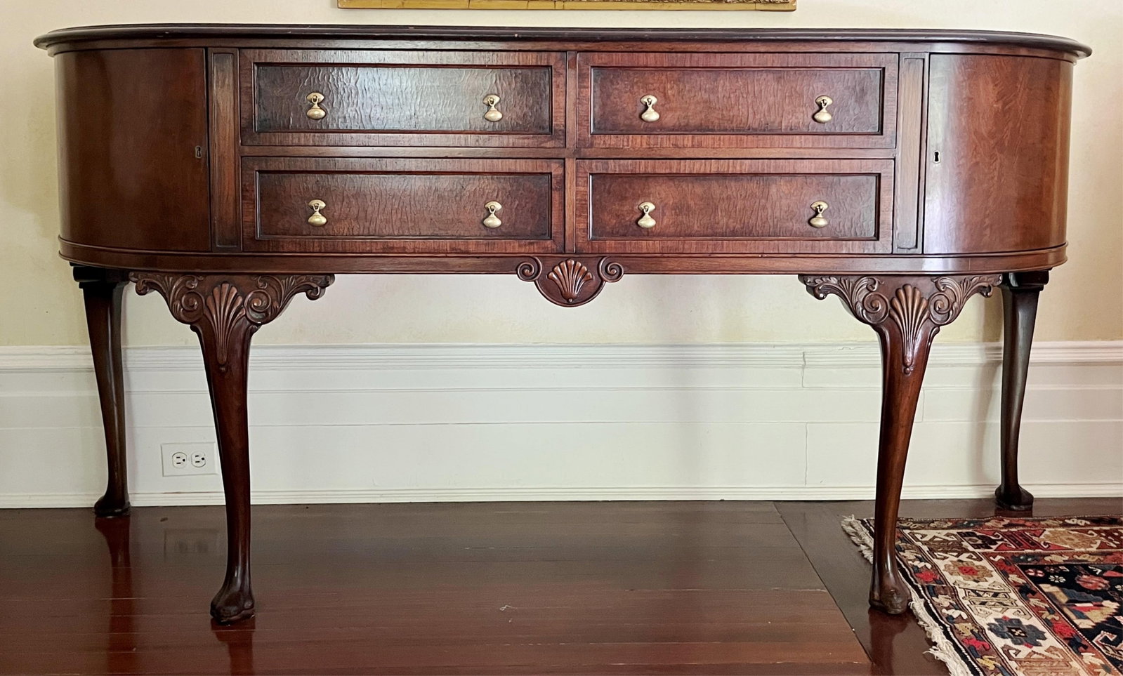 EDWARDIAN QUEEN ANNE-STYLE MAHOGANY BOW-FRONT SIDEBOARD - H: 37 1/2 IN; W: 75 IN; D: 22 IN.: EDWARDIAN QUEEN ANNE-STYLE MAHOGANY BOW-FRONT SIDEBOARD Two banks of two drawers H: 37 1/2 IN; W: 75 IN; D: 22 IN PROVENANCE: ?Merry Hill?, an historic mansion built in 1899 and located in Greenspring