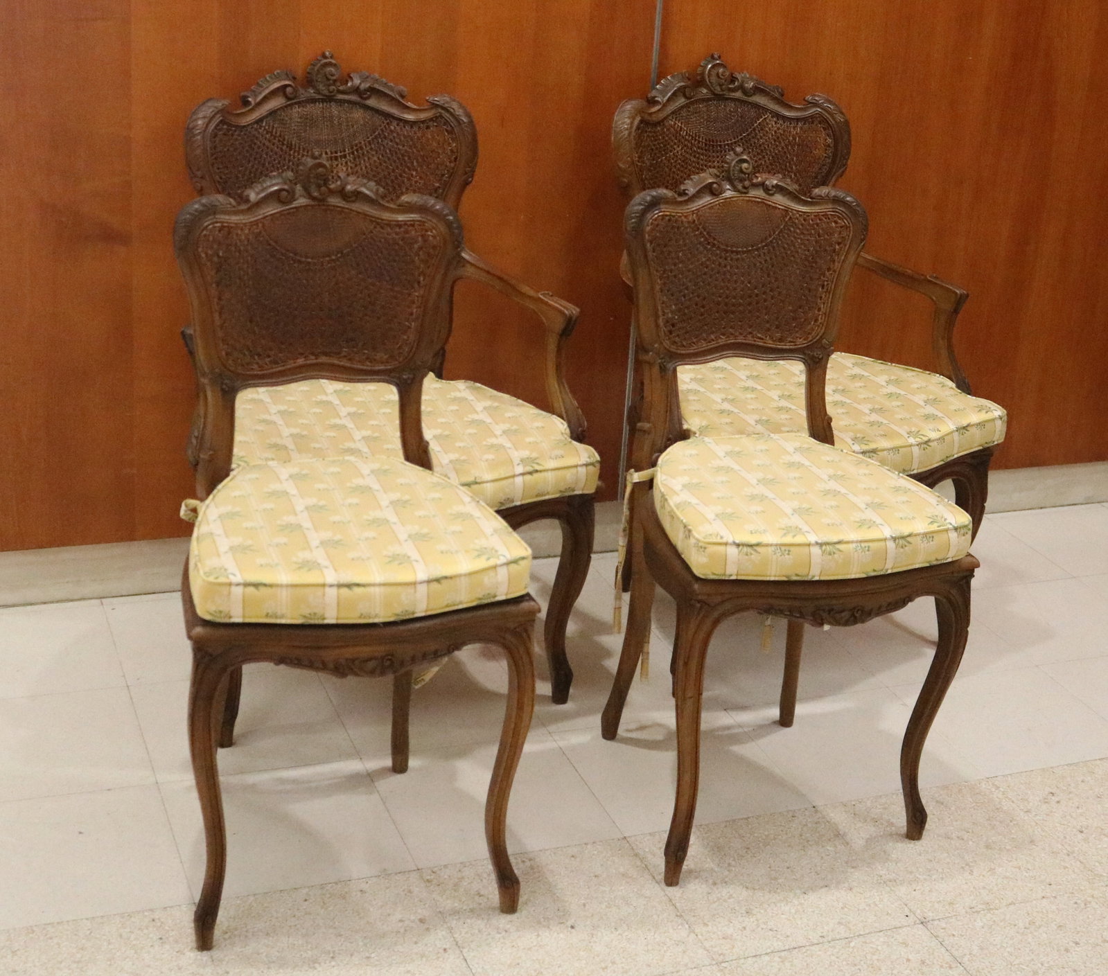 SET FOUR LOUIS XV STYLE-CARVED FRUITWOOD CHAIRS WITH CANED SEATS AND BACKS - .: SET FOUR LOUIS XV STYLE-CARVED FRUITWOOD CHAIRS WITH CANED SEATS AND BACKS Carved crests; shield-shape seats; tie-on seat cushions