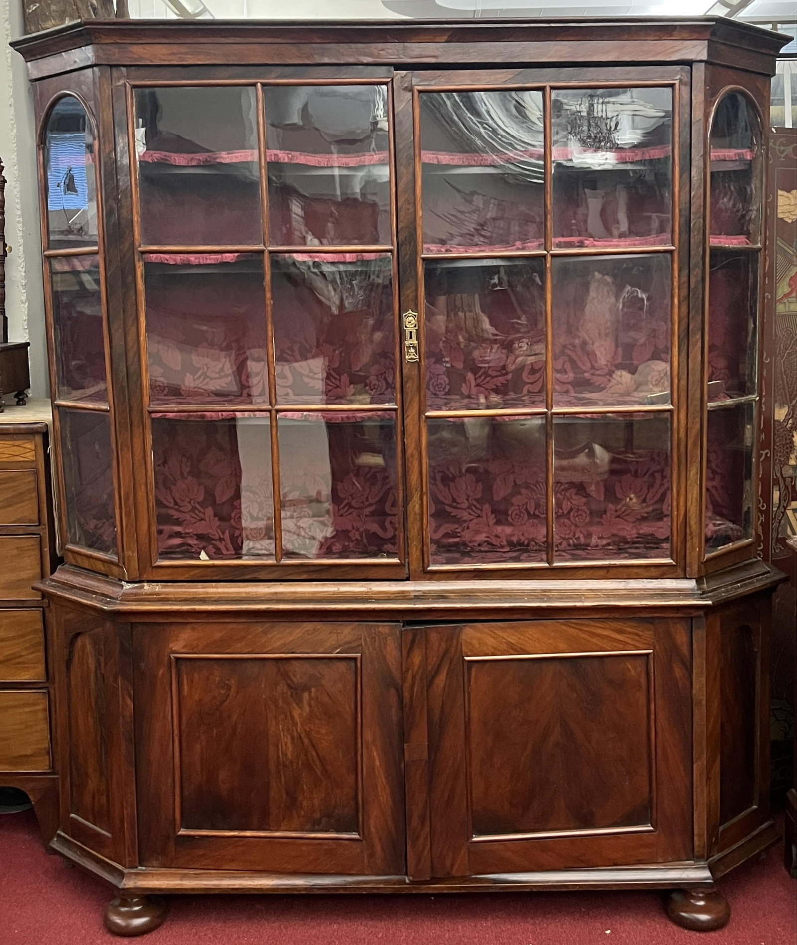 DUTCH WALNUT GLASS PANEL DISPLAY CABINET - H: 78 IN; W: 75 IN; D: 18 IN.: DUTCH WALNUT GLASS PANEL DISPLAY CABINET Flat, flaring cornice over pair glazed doors and canted side panels; three fabric lined shelves; base fitted with pair cabinet doors; bun feet H: 78 IN; W: 75 