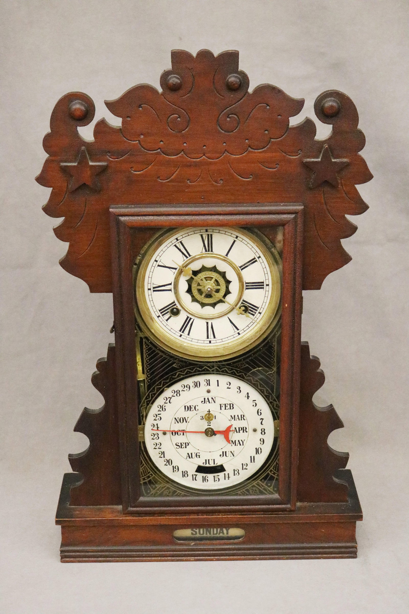 DOUBLE-DIAL PENDULUM MANTEL CLOCK WITH FRET-CARVED CASE late 19th century - H: 22 in.. (1 of 7)