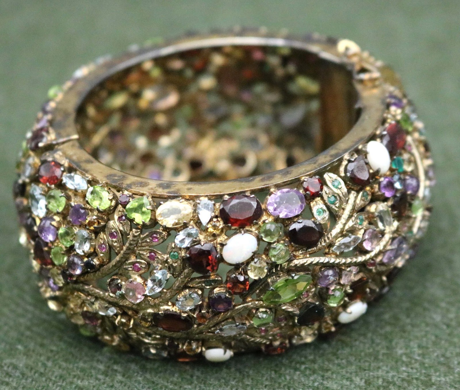 GILT-STERLING SILVER AND JEWELED HINGED CIRCULAR "STATEMENT" CUFF BRACELET - D: 3 3/4". W: 1 3/4". (1 of 18)