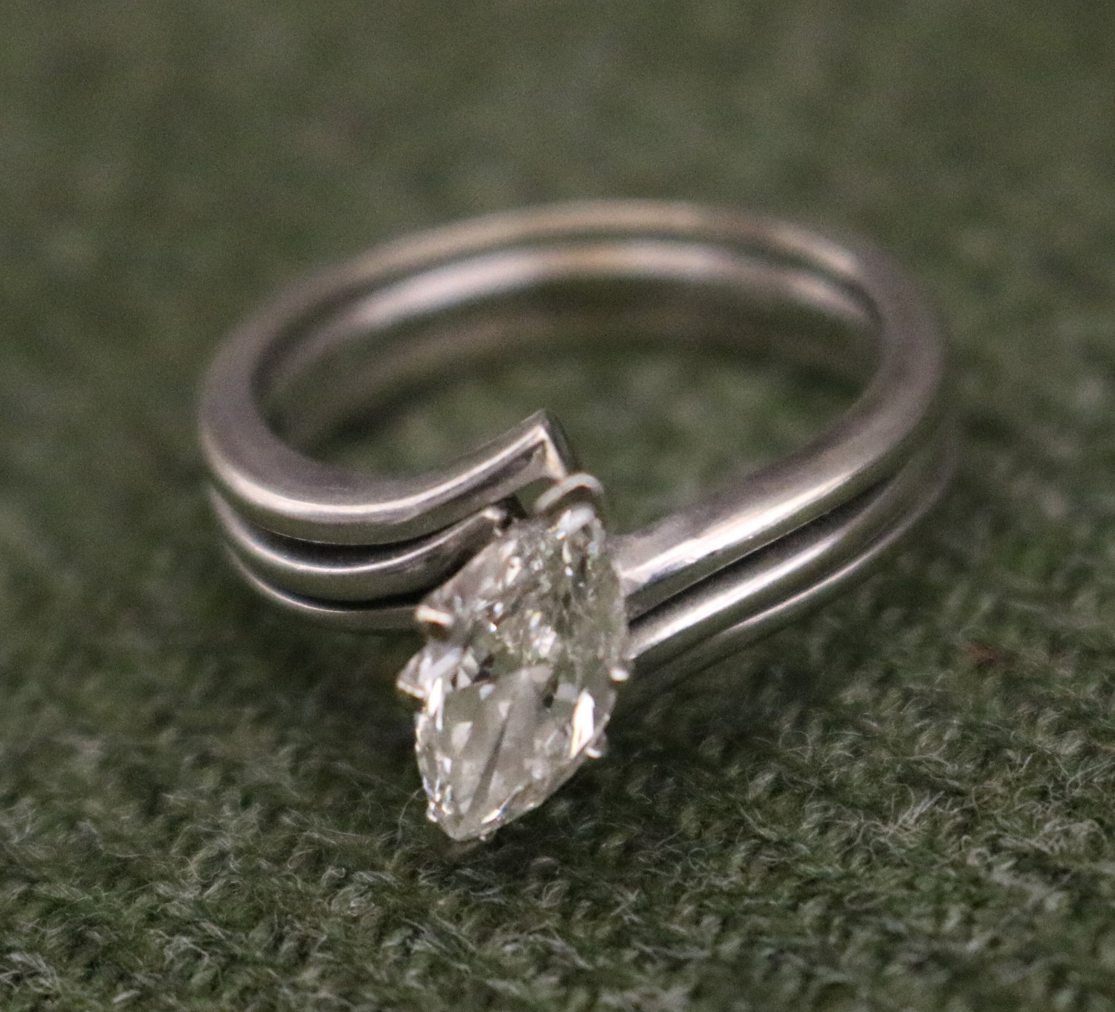 14K WHITE GOLD AND MARQUISE DIAMOND ENGAGEMENT TYPE RING WITH JACKET STYLE WEDDING BAND - Ring size:: 14K WHITE GOLD AND MARQUISE DIAMOND ENGAGEMENT TYPE RING WITH JACKET STYLE WEDDING BAND Plain polished cross-over design shank centers marquise diamond weighing approximately .75 ct, held by six prong