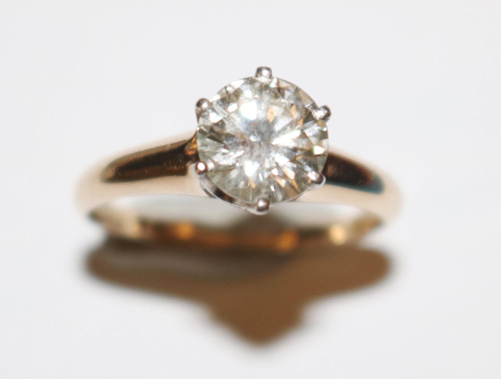 14K YELLOW GOLD AND DIAMOND ENGAGEMENT-TYPE RING - Ring size: 7. Gross wt. 2.43 dwt..: 14K YELLOW GOLD AND DIAMOND ENGAGEMENT-TYPE RING Brilliant-cut round diamond weighing app. 1.45 ct. Color grade I-J Clarity grade VS2 Appraisal information prepared by Fuller & Associates, Reston, VA 