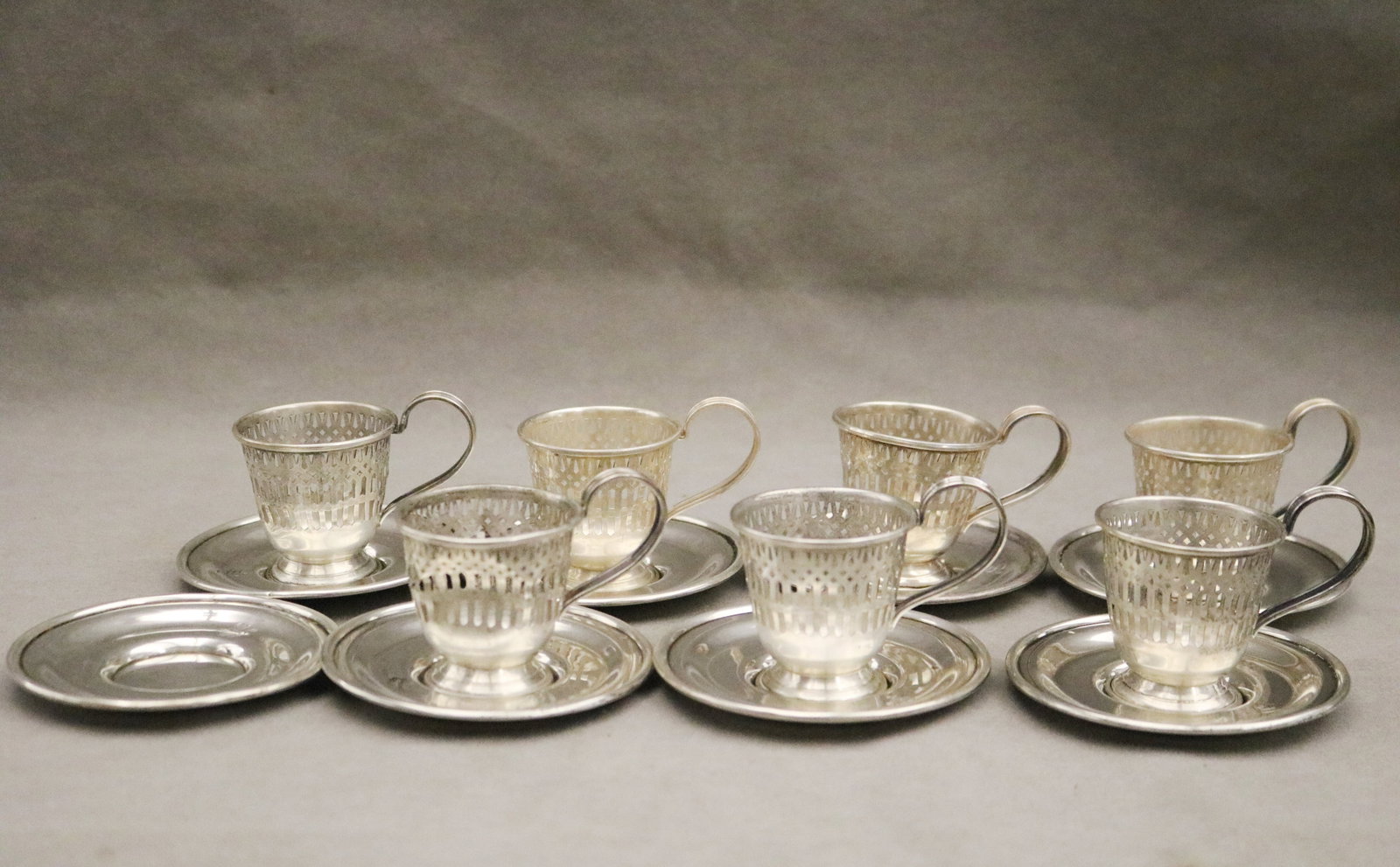 SET SEVEN STERLING SILVER PIERCED DEMITASSE CUP FRAMES WITH EIGHT CIRCULAR SAUCERS - Wt.: 10 troy (1 of 7)