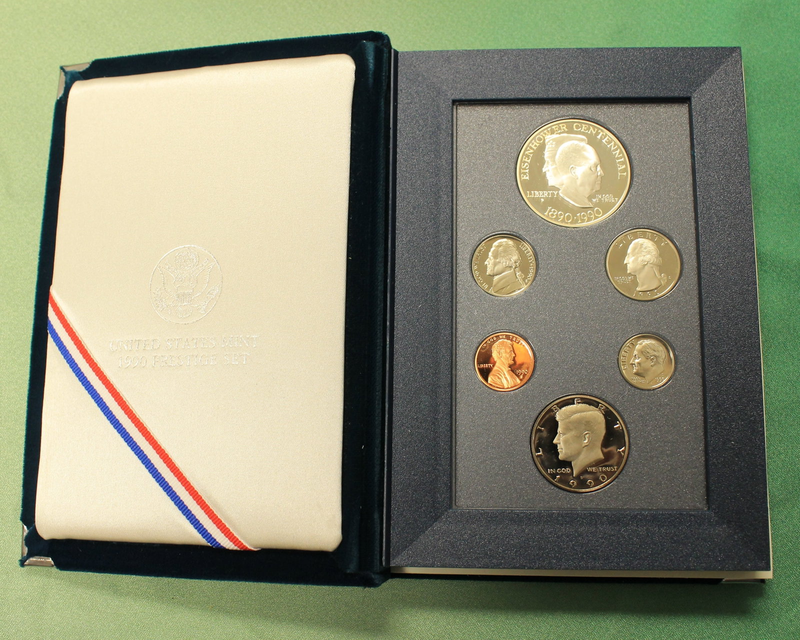 FIVE U.S. MINT SIX-COIN PRESTIGE SETS EACH WITH SILVER DOLLAR - .: FIVE U.S. MINT SIX-COIN PRESTIGE SETS EACH WITH SILVER DOLLAR Including 1984 (Olympic dollar); 1986; two 1990; and 1991
