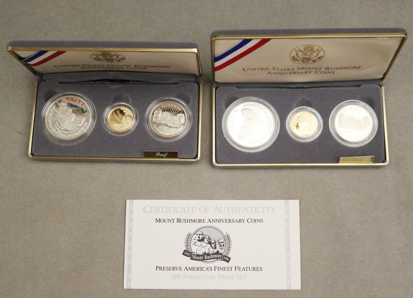 TWO U.S. MOUNT RUSHMORE ANNIVERSARY SILVER AND GOLD PROOF THREE-COIN SETS, 1991 - . (1 of 4)