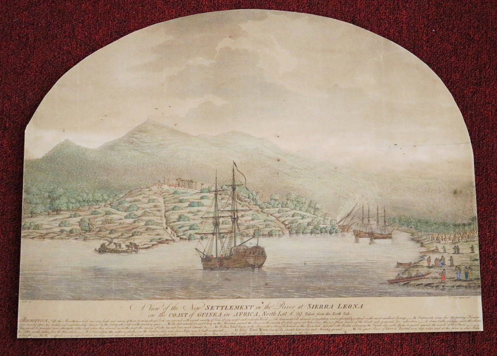 A VIEW OF THE NEW SETTLEMENT IN THE RIVER AT SIERRA LEONA ON THE COAST OF GUINEA IN AFRICA - 15.5 x: A VIEW OF THE NEW SETTLEMENT IN THE RIVER AT SIERRA LEONA ON THE COAST OF GUINEA IN AFRICA An arch-topped, hand-colored engraving depicting the early Sierra Leone settlement, showing sailing vessels i