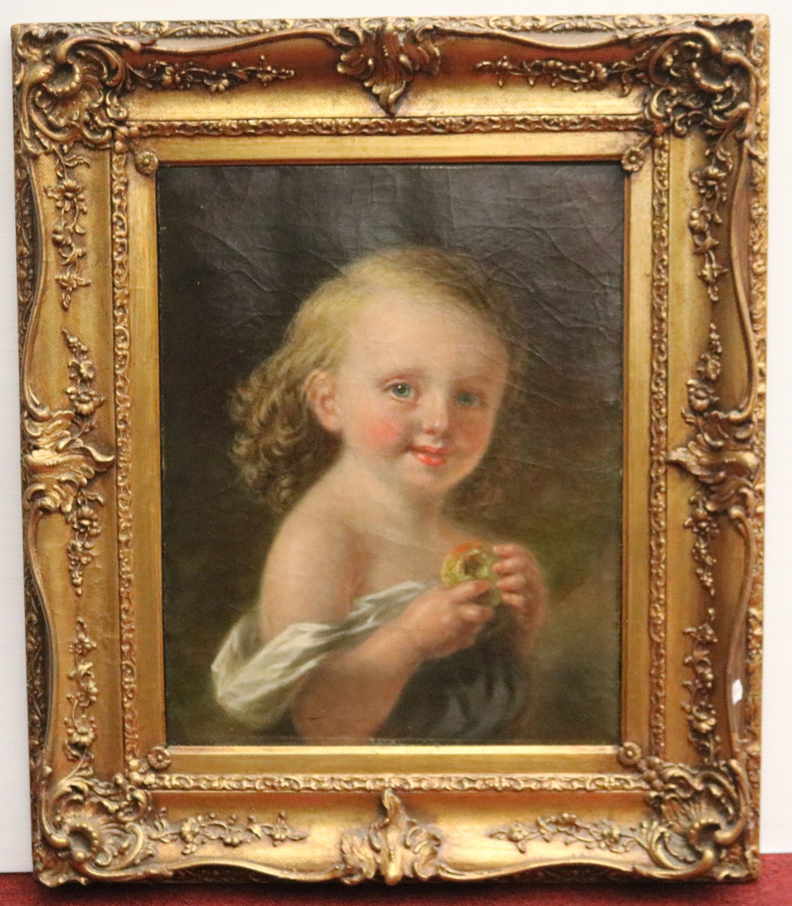 CONTINENTAL SCHOOL (19th century). Portrait of a Child Holding an Apple, Oil on canvas, 19 x 14.5: CONTINENTAL SCHOOL 19th century Portrait of a Child Holding an Apple Oil on canvas Unsigned. Portrait style painting, this half-length portrait depicts a fair-haired child with rosy cheeks and curly h