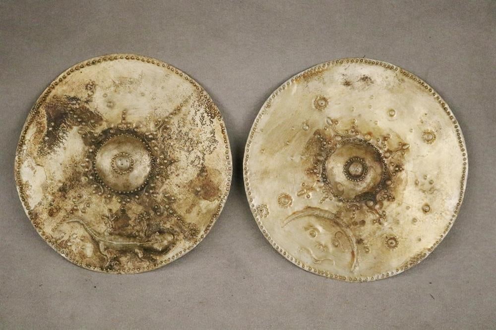 INDONESIAN TIMOR PECTORAL TROPHY DISCS. Set of two patinated Timor pectoral discs, also known as (1 of 20)