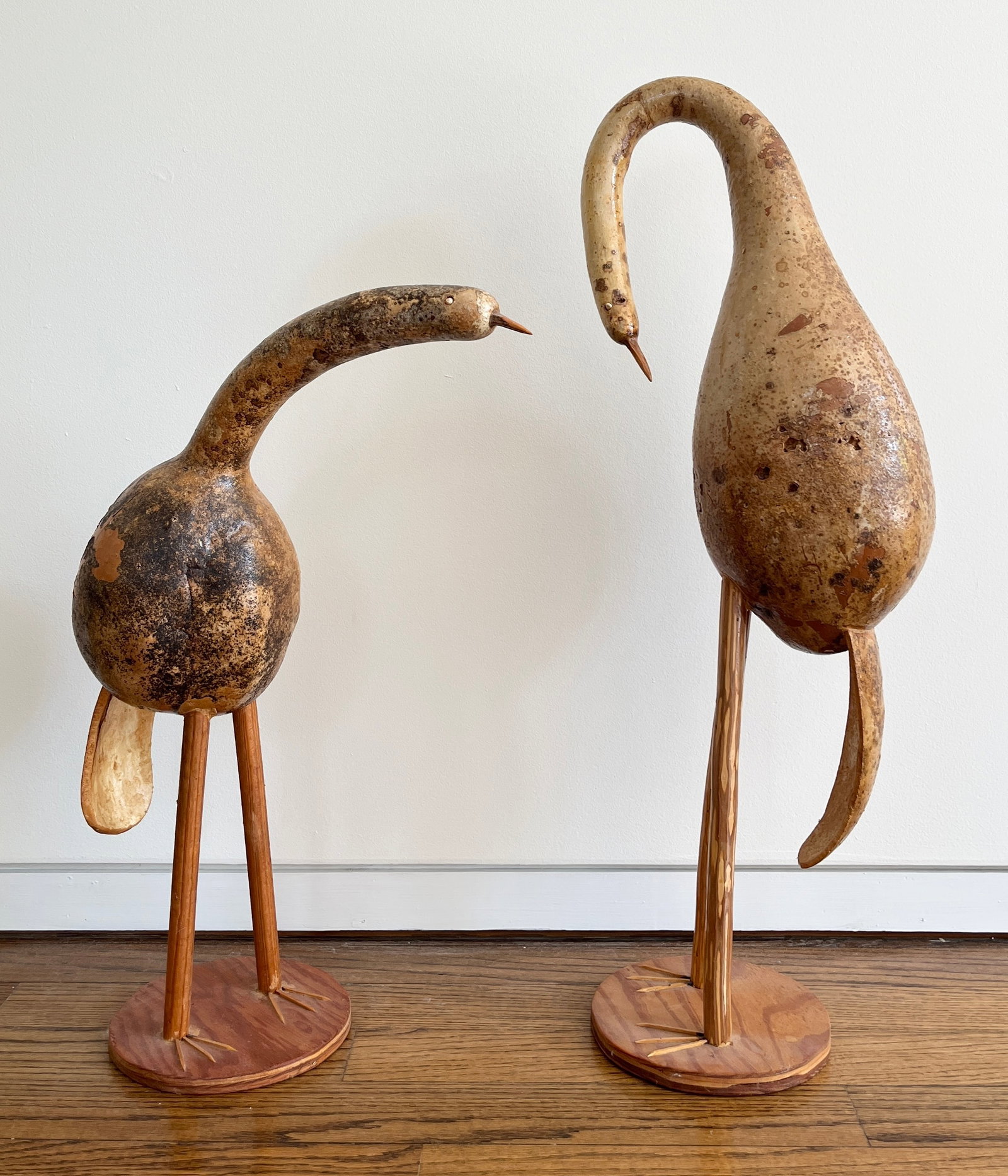 WHIMSICAL GOURD AND ROOT-WOOD BIRD FIGURES, A PAIR - .: WHIMSICAL GOURD AND ROOT-WOOD BIRD FIGURES, A PAIR Whimsical pair of folk-art bird sculptures fashioned from natural speckled gourds for the bodies and curved wood or root elements for the necks, head