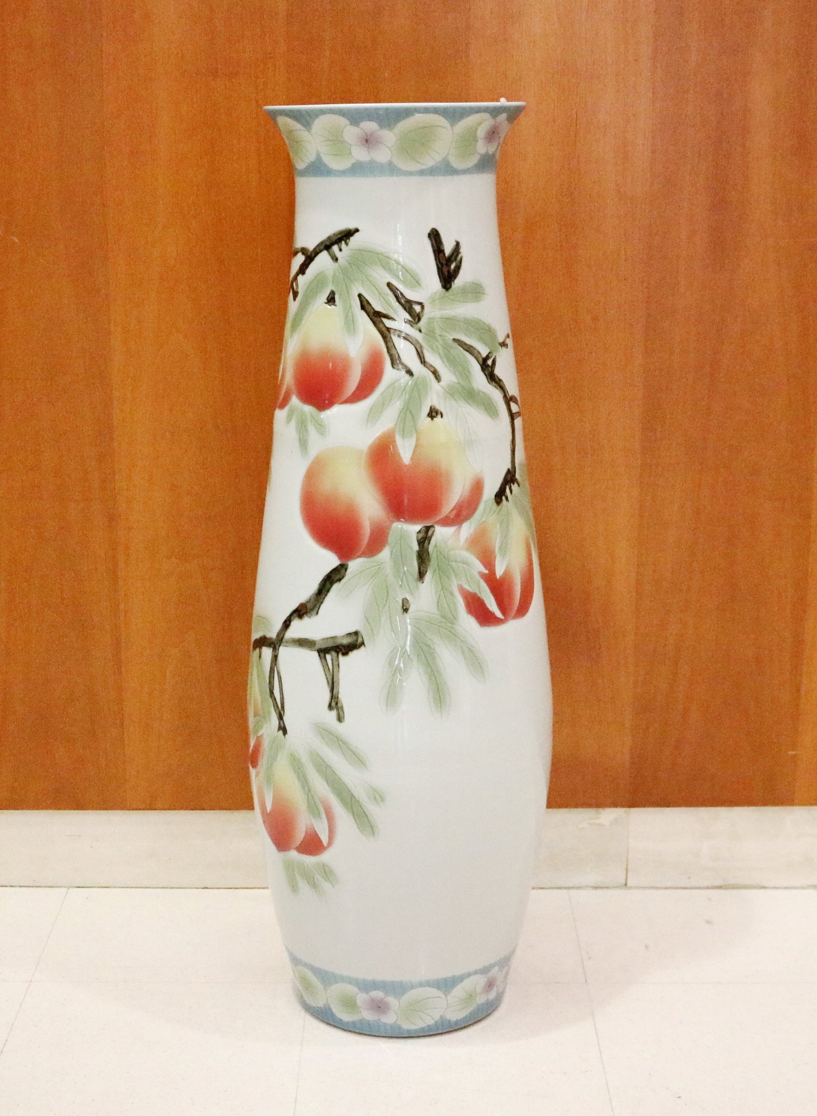 CONTEMPORARY SIGNED JAPANESE PAITNED PORCELAIN ELONGATED DROP-SHAPE VASE - H: 36 3/4 in..: CONTEMPORARY SIGNED JAPANESE PAITNED PORCELAIN ELONGATED DROP-SHAPE VASE Relief decoration of peach branches. Scratch-carved signature in characters under base; painted characters on lower mid-section
