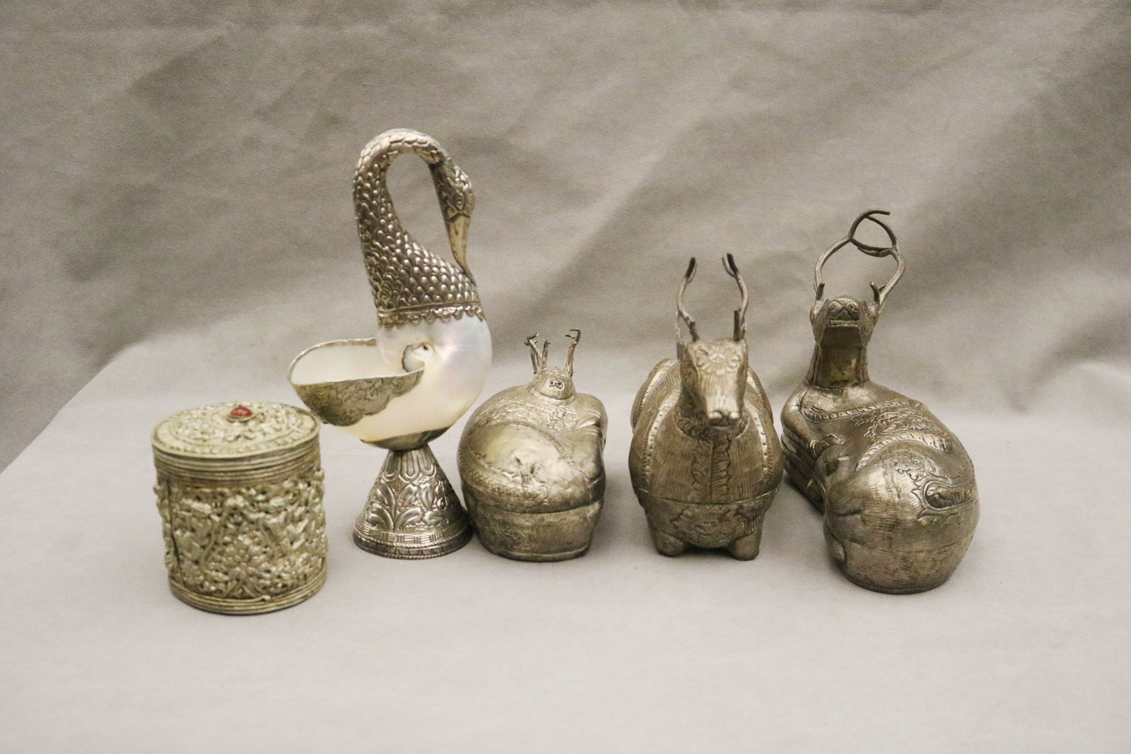 FIVE SOUTHEAST ASIAN TABLETOP DECORATIVE SILVERED METAL ITEMS - Ewer, H: 9 3/8 in.. (1 of 2)