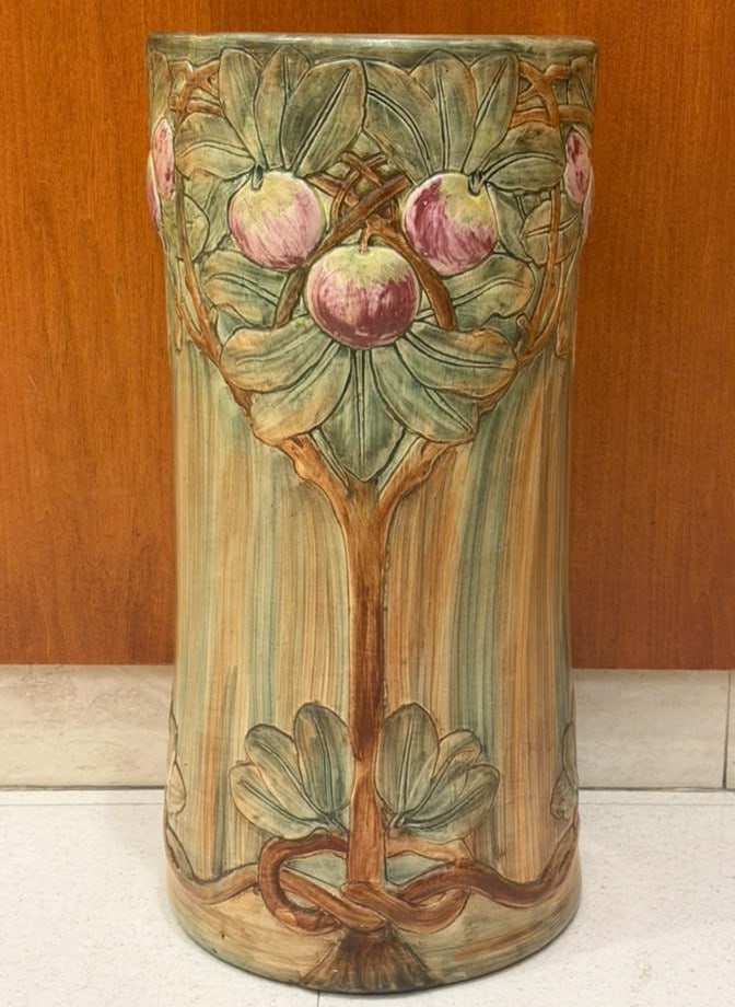 PAINTED ART POTTERY UMBRELLA JAR early 20th century - H: 22 1/2 in. D: 10 3/4 in..: PAINTED ART POTTERY UMBRELLA JAR early 20th century Relief decoration of apple trees with apples. H: 22 1/2 in. D: 10 3/4 in.