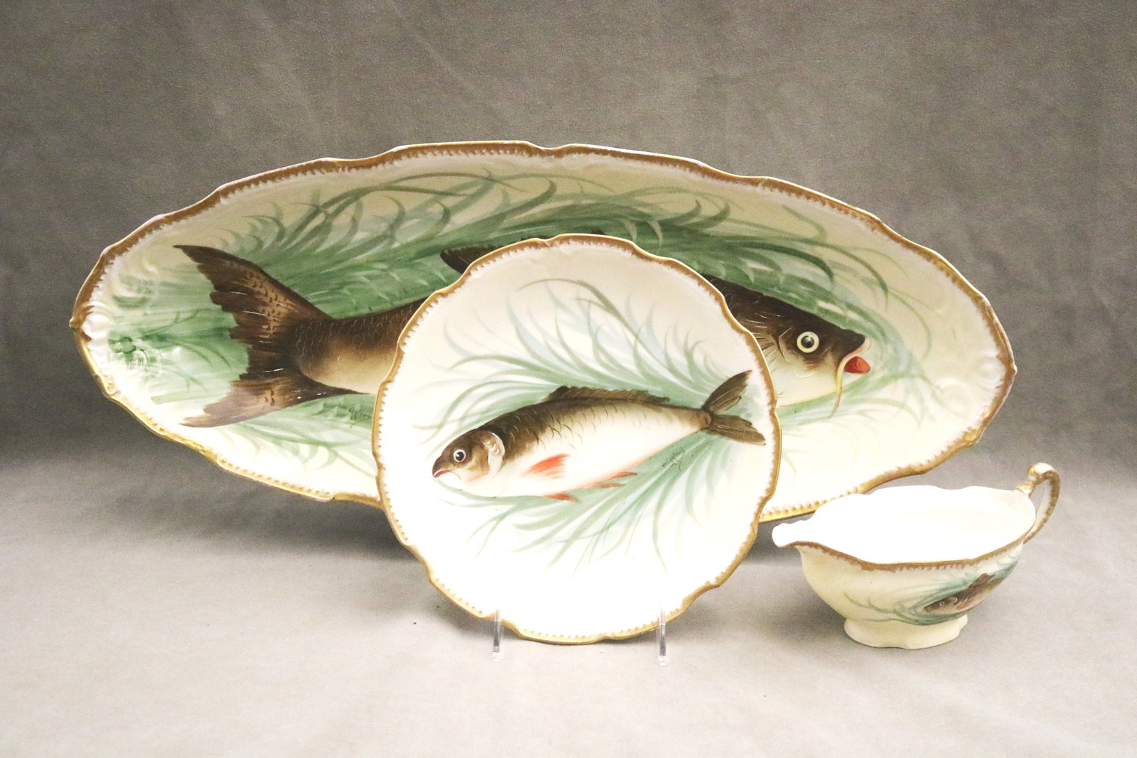 TEN-PIECE LIMOGES POLYCHROME-PAINTED PORCELAIN FISH SERVICE - Platter, L: 24 in.. (1 of 8)