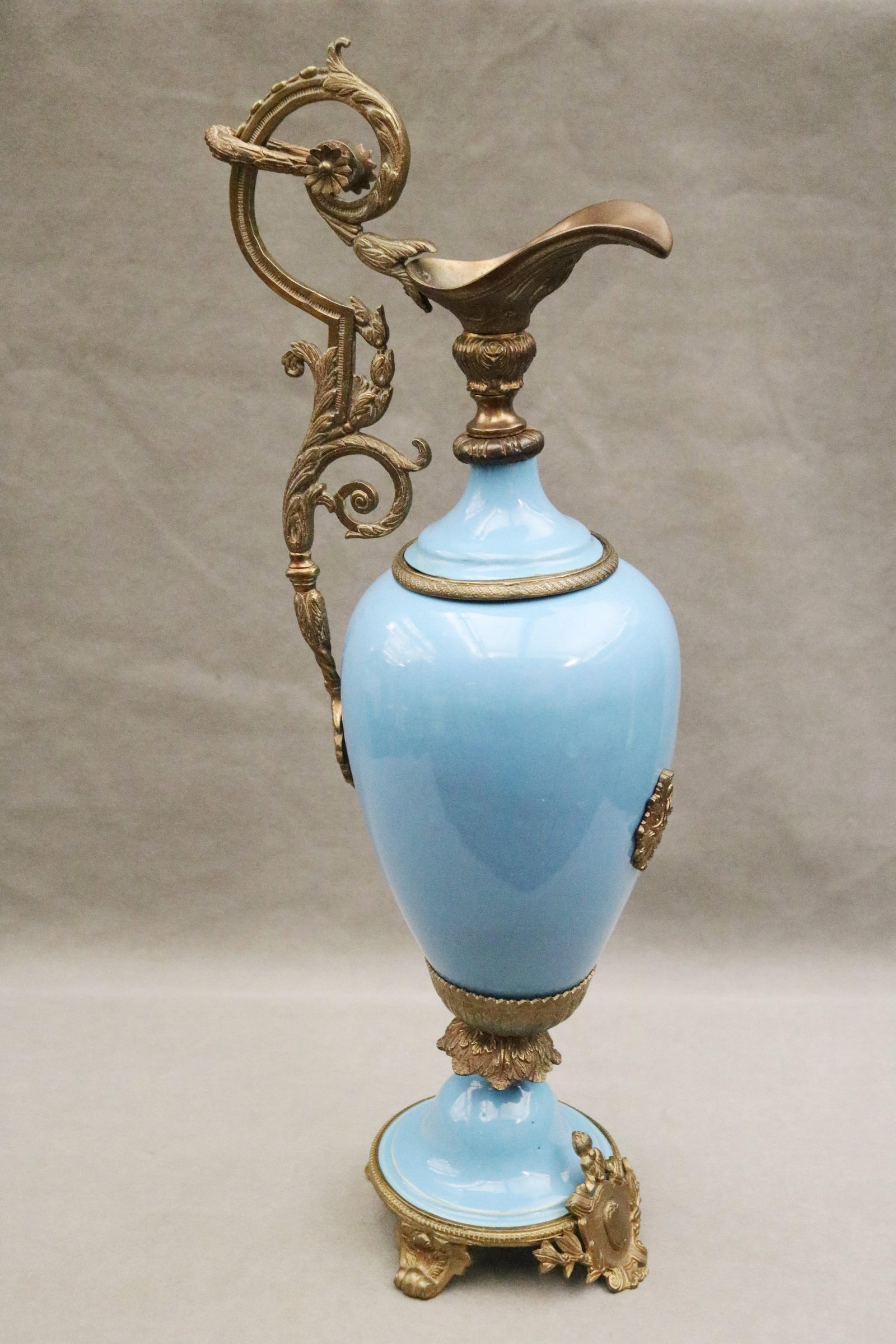SEVRES CELESTE BLUE PORCELAIN FOOTED EWER WITH GILT METAL MOUNTS 19th century - H: 21 1/2 in..: SEVRES CELESTE BLUE PORCELAIN FOOTED EWER WITH GILT METAL MOUNTS 19th century H: 21 1/2 in.