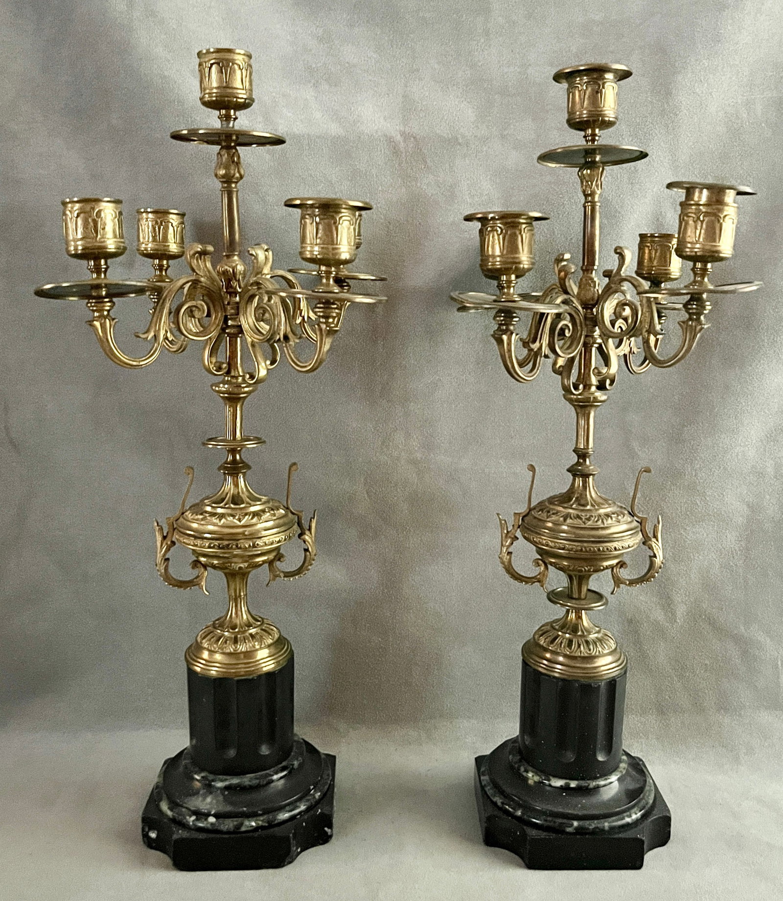 PAIR FIVE-LIGHT URN-FORM BRASS CANDELABRA WITH CYLINDRIAL MARBLE SOCLES late 19th century - H: 17: PAIR FIVE-LIGHT URN-FORM BRASS CANDELABRA WITH CYLINDRIAL MARBLE SOCLES late 19th century H: 17 1/2 in. PROVENANCE: Estates of Rosalee Cohen Davison and Richard "Dick" Samuel Davison, Baltimore, MD PR