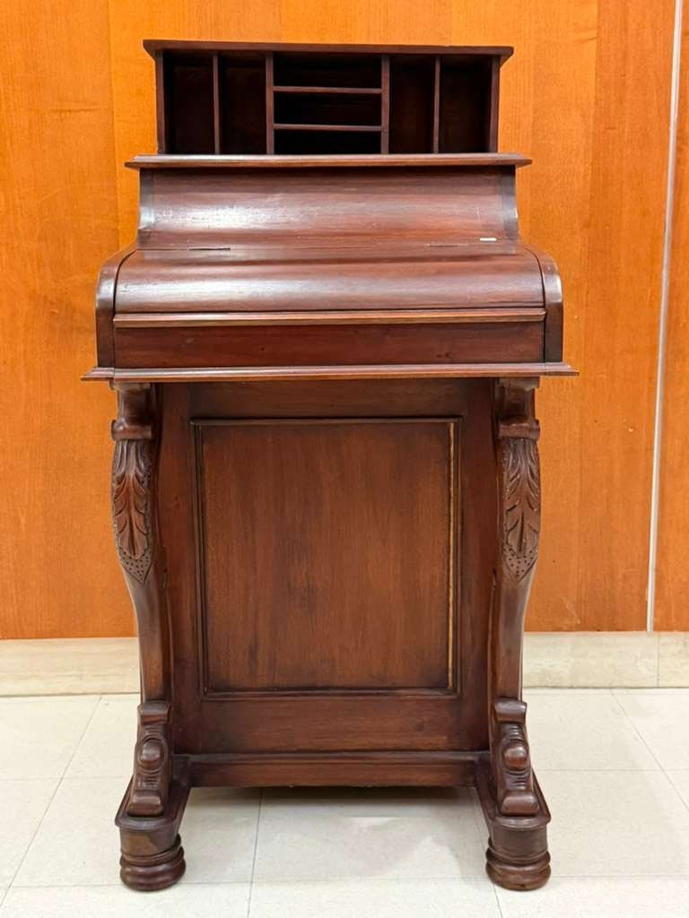 CARVED MAHOGANY DAVENPORT DESK 19th century - H: 42 in., with top extended; W: 22 in. D: 22 1/2 in..: CARVED MAHOGANY DAVENPORT DESK 19th century Of typical-form with mechanically operating letter compartment H: 42 in., with top extended; W: 22 in. D: 22 1/2 in.