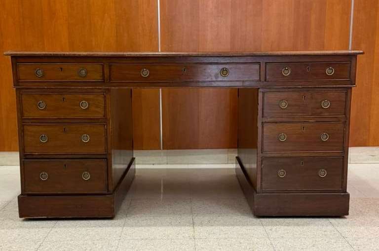 GEORGE III MAHOGANY NINE-DRAWER, DOUBLE-PEDESTAL DESK WITH GOLD-TOOLED GREEN LEATHER INSET TOP - H:: GEORGE III MAHOGANY NINE-DRAWER, DOUBLE-PEDESTAL DESK WITH GOLD-TOOLED GREEN LEATHER INSET TOP H: 29 1/2; W: 60; D: 36 1/2.