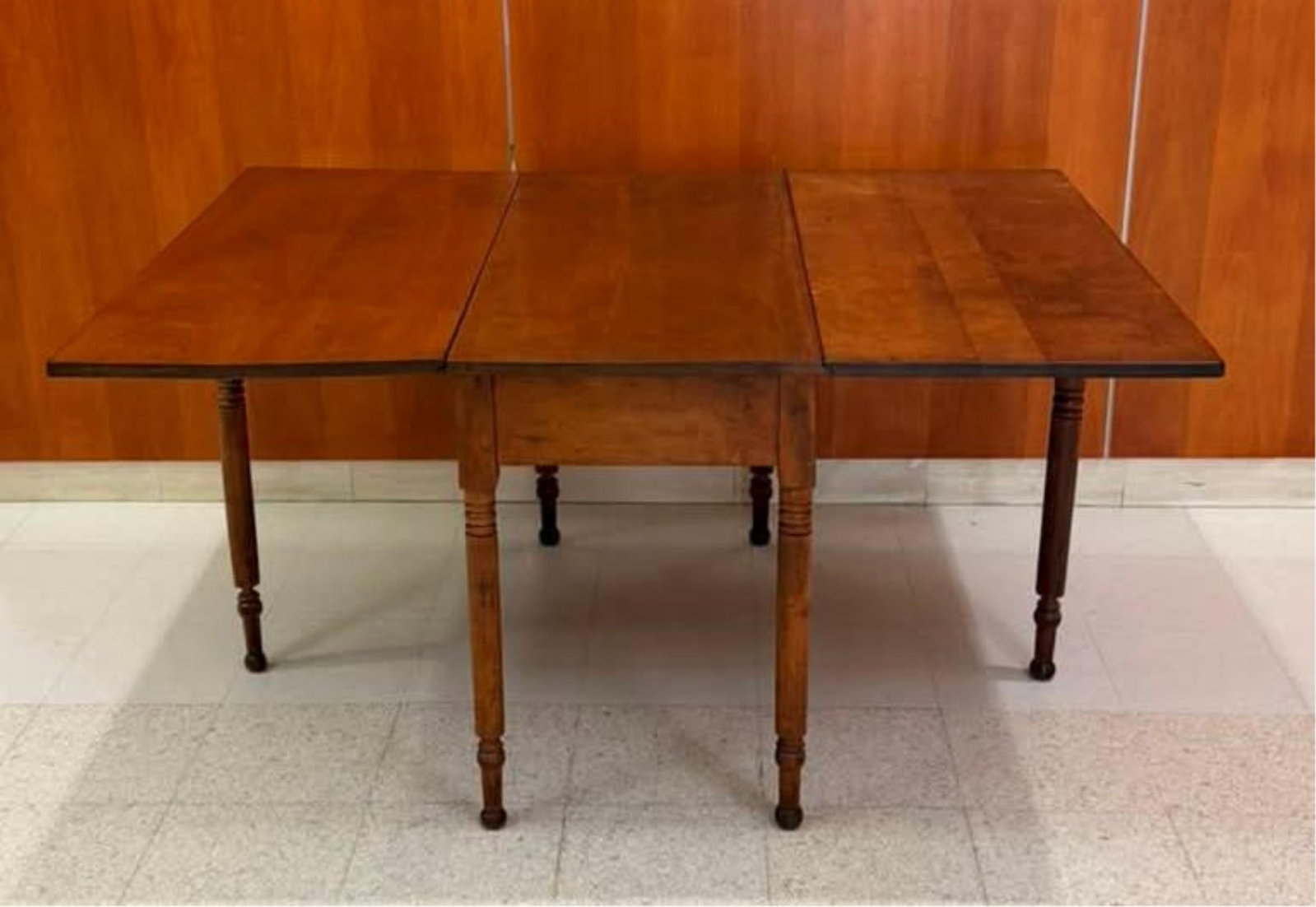 AMERICAN VICTORIAN CHERRYWOOD DROP-LEAF TABLE mid 19th century - H: 29 1/2 in. Top, fully extended,: AMERICAN VICTORIAN CHERRYWOOD DROP-LEAF TABLE mid 19th century Six ring-turned circular legs, two gated as leaf supports, end in peg-and button feet. H: 29 1/2 in. Top, fully extended, 80 in. x 45 1/4