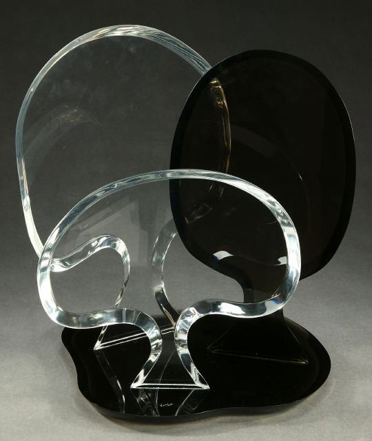 A MODERN LUCITE SCULPTURE, signed Van Te: A MODERN LUCITE SCULPTURE, signed Van Teal. On a molded black base, with two clear and one black spade forms - 19 x 14 1/2 in.