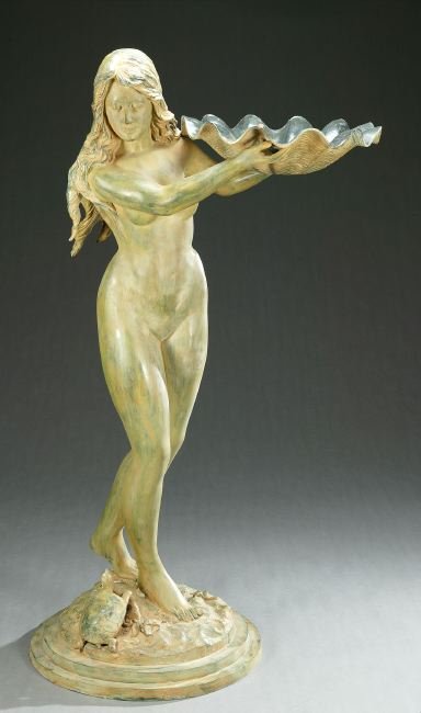 A PATINATED BRONZE FIGURE OF A MAIDEN HOLDING A C: A PATINATED BRONZE FIGURE OF A MAIDEN HOLDING A CLAM SHELL, 20th century. On a rocky base with a turtle and starfish - 62 3/4 in. x 35 in. x 25 in.