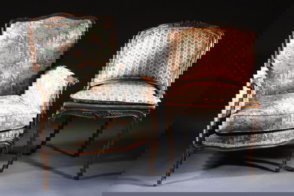 TWO FRENCH PROVINCIAL CARVED FRUITWOOD PETITE CHAI: TWO FRENCH PROVINCIAL CARVED FRUITWOOD PETITE CHAISES, 19th century. One with scrolling foliate rocaille crest, padded upholstered barrel-back, D" shaped serpentine seat, carved apron and cabriole leg