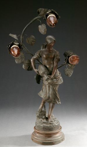 A BRONZE FIGURE OF A WOMAN WITH WATER PITCHER: A BRONZE FIGURE OF A WOMAN WITH WATER PITCHER, marked J. Causse, 'A La Fontaine' par Causse (Sculptr). Cast from the model by Causse, mounted as a three light lamp - 25 in. high overall.
