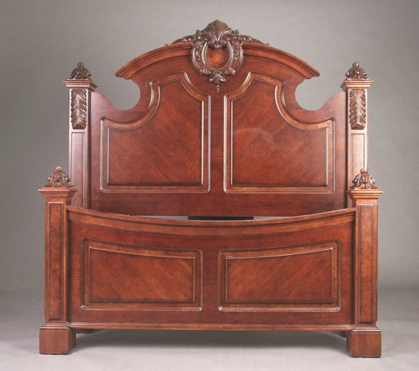CONTEMPORARY CONTINENTAL STYLE CARVED AND PANELLED: CONTEMPORARY CONTINENTAL STYLE CARVED AND PANELLED MAHOGANY QUEEN SIZE BED FRAME, 20th century. Shell-carved crest; above molded-edge arching crest rail, panelled head board, berried finial-topped squ