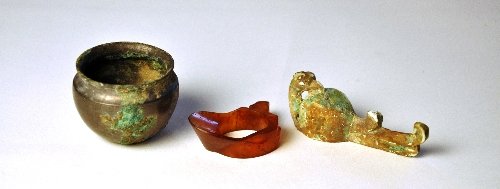 A Chinese Warring states cornelian musical plectrum Len: A Chinese Warring states cornelian musical plectrum Length 4 cm a miniature Warring states bronze vessel and a bronze phoenix belt hook