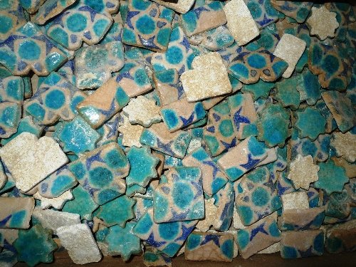 A large C18th Syrian tile unset and lose, the turquoise: A large C18th Syrian tile unset and lose, the turquoise and blue star and circle repeating motifs and white background. Please note only part shown.