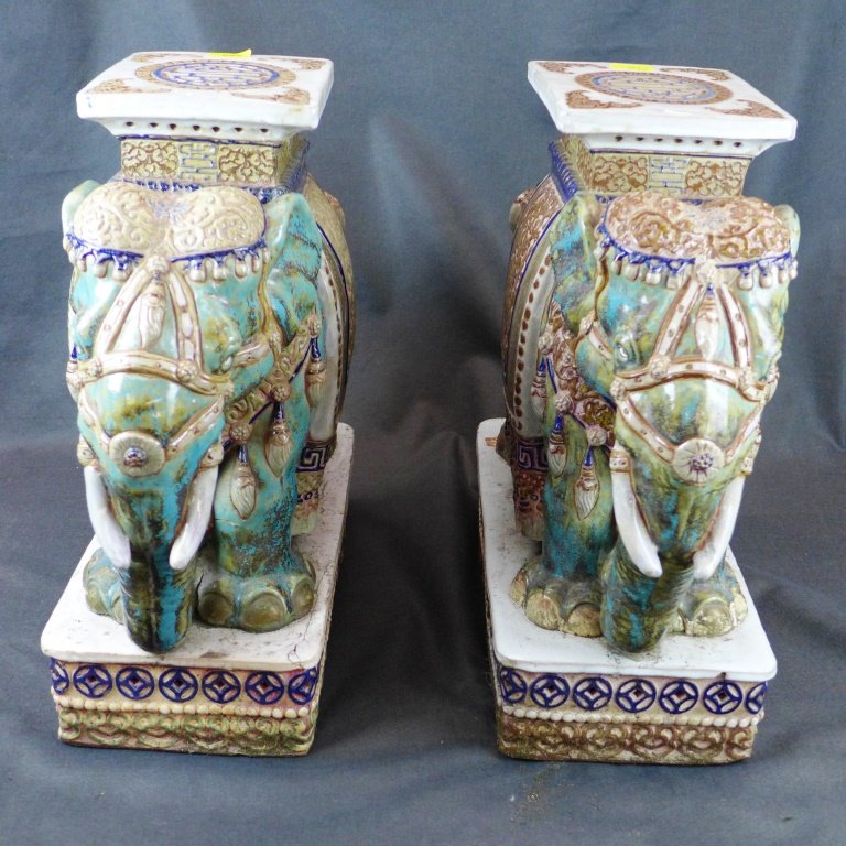 A pair of Chinese porcelain turquoise elephant shaped: A pair of Chinese porcelain turquoise elephant shaped planters on platform bases H53cm