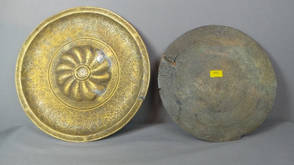 A C12th Saljugh brass incised base with fine: A C12th Saljugh brass incised base with fine calligraphic and foliate detail together with a C19th Syrian tray