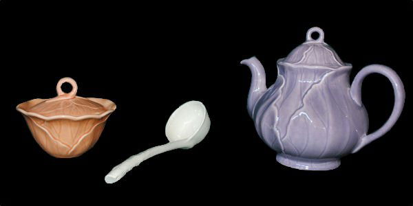 Metlox Poppytrail Lotus Serveware - 3pc Lot: Lot of three vintage majolica Metlox Poppytrail Lotus pieces including a peach covered sugar bowl (5"w), 8" white ladle, and lilac teapot (7"h x 9"w). Excellent. The sugar bowl had had a repair beneat