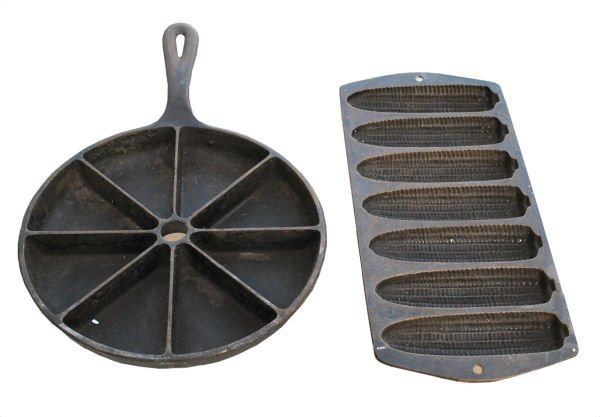 Lot of 2: Cast Iron Cornbread Pans: One round divided cornbread pan by Lodge (13"x9"d) - marked small 'D' over large '8' on back; one cornstick mold pan (12.5" x 6") - marked 'R' on one side and '2' on the other side on back. Both cast 