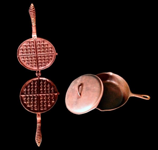 Lot of 2: Cast Iron Cookware: Vintage cast iron cresecent waffle maker and lidded skillet. Waffle maker is marked Fanner Mfg Co, Cleveland, OH. Skillet is marked Made in U.S.A., No. 8, 10-5/8".
