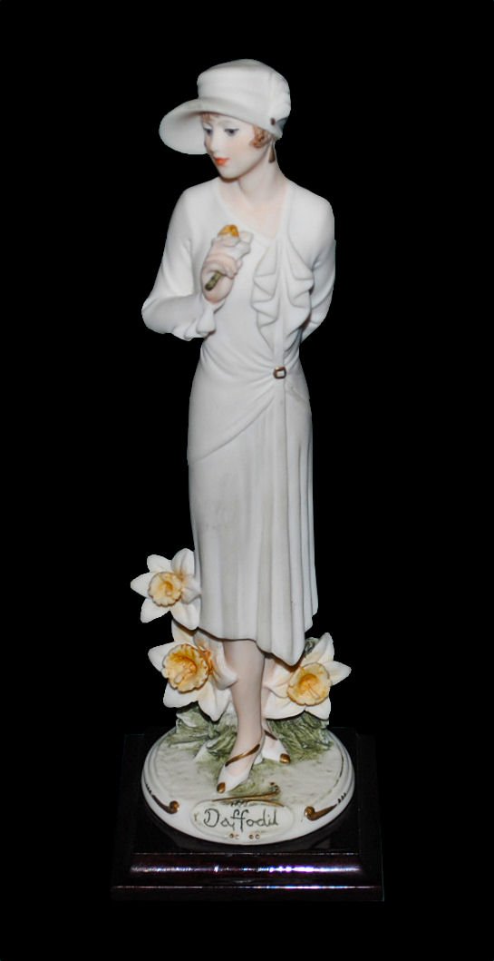 GIUSEPPE ARMANI (1935-2006) Signed Figurine 'Daffodil': GIUSEPPE ARMANI (1935-2006) Woman Figurine 'Daffodil', 1998. Giuseppe Armani, born in Calci, Italy, was recognized and commissioned by Florence Sculture d'Arte in 1975 and given free reign to design h