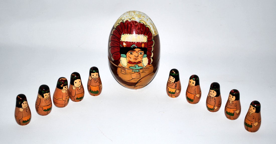 Wooden Indian Nesting Dolls: Painted wood indian doll with 10 nesting Indians inside. Large Indian is 3.5"w x 6"h.