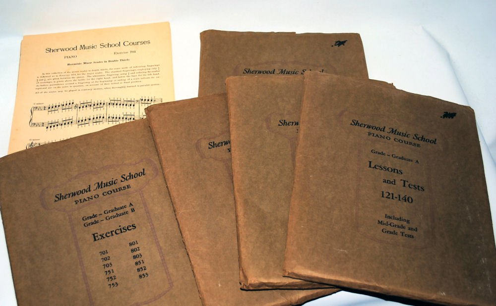 1930 Ephemera Sherwood Music School: Lot of 5 full packets of piano lessons from Sherwood School of Music in Chicago from 1930. Many lessons, tests and sheet music. Counted 1 packet and there were 21 pieces inside.