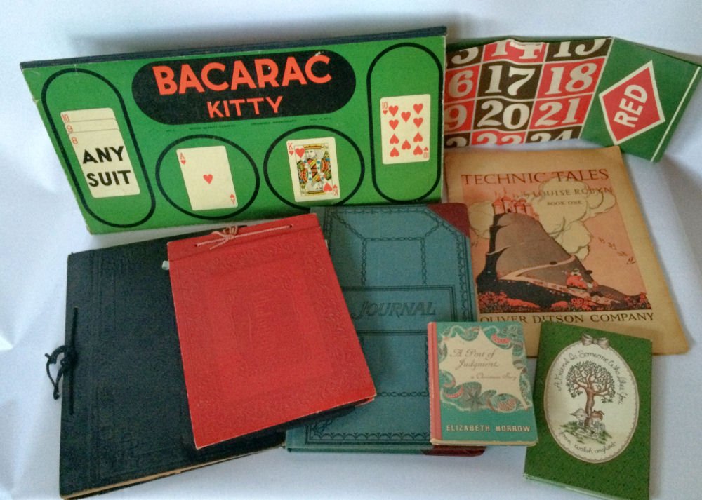 Lot of Ephemera: Mixed lot of ephemera including game boards, ledger, scrap books, albums, sheet music, books etc. 1920s on up.