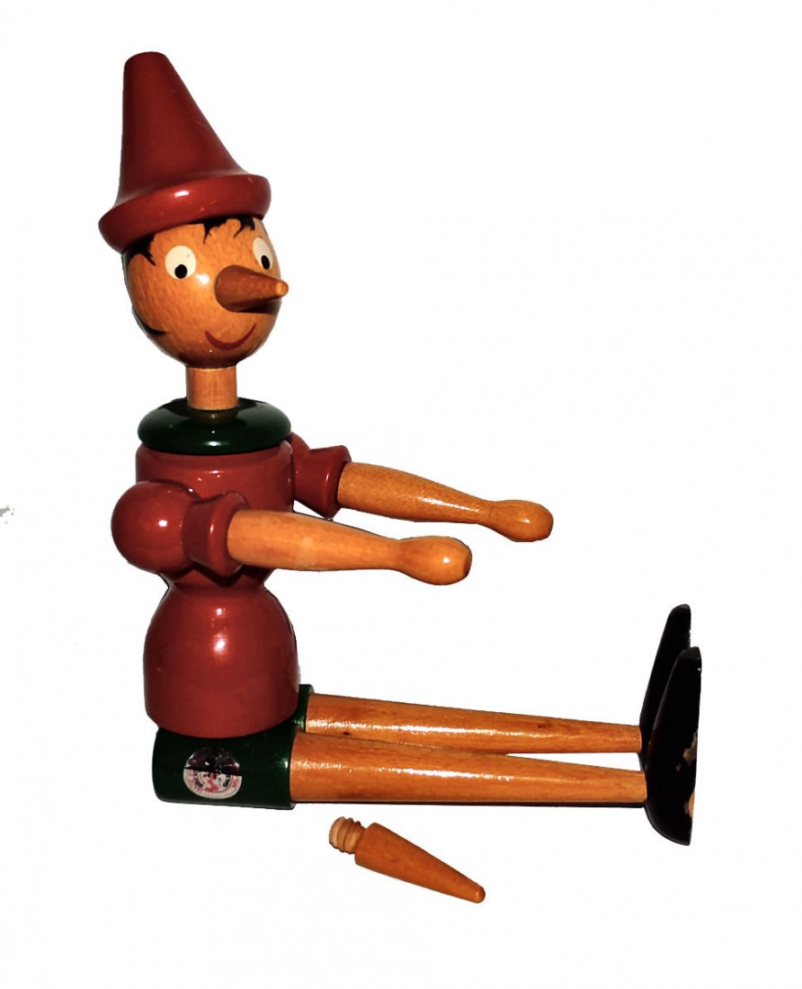 Galetti Pinocchio Wooden Doll: Wooden Pinocchio by Giocattoli Galetti, made in Milan Italy; signed on bottom J McLane 1984. Approx 24" in length, comes with second nose that is longer and interchangeable. Vibrant colors; posable.