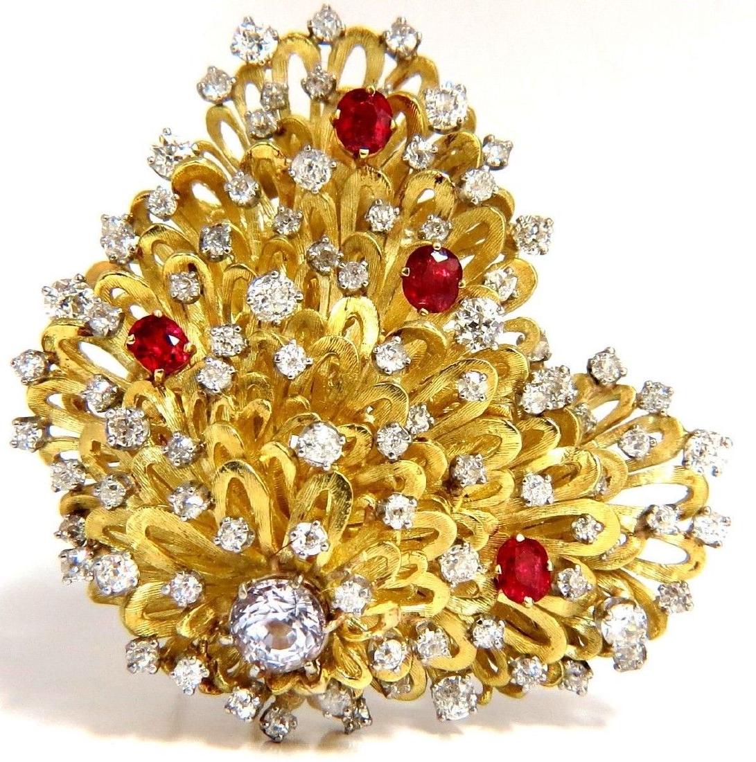 ERWIN PEARL 8.00ct. NATURAL DIAMONDS & RED SPINEL: Erwin Pearl Handmade raised Brooch6.00ct. diamonds & 2.00ct. natural red spinelsDiamonds: H-I color Si-1 Si-2 clarity.Larger white stone in center: White sapphire 7.3 X 7.1mm18kt yellow gold 73 grams.