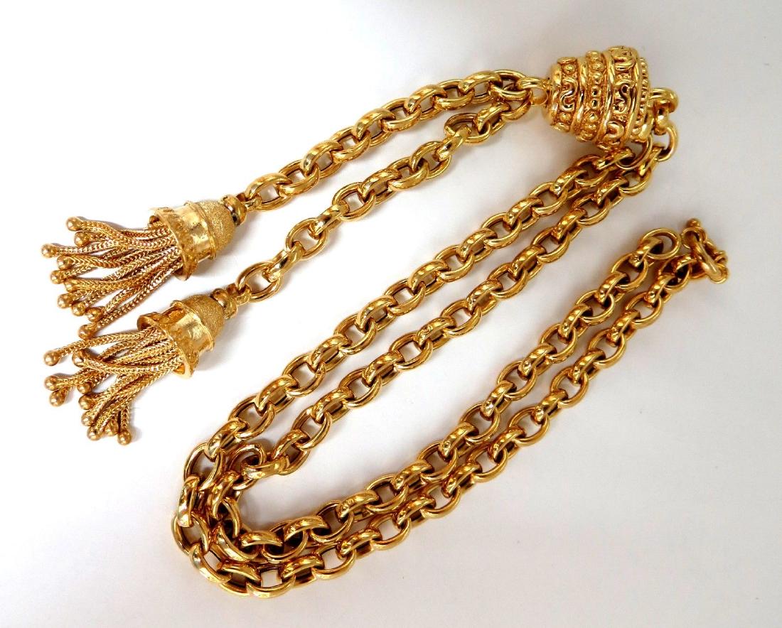 14kt Tassel Toggle Style Necklace: Tassel Toggle Style neckaceNecklace:17 Inches (wearable length)3.25 inches center bolo dangle14kt. yellow gold .62 x .66 inch23 Grams. safety locking clasp