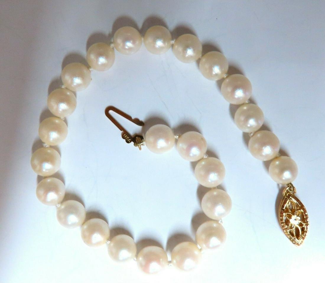 6.5mm Akoya pearls pearl bead bracelet 14kt: 6.5 mm Akoya pearls bracelet.14 karat yellow gold7 in Long