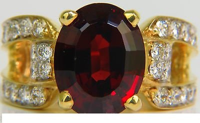 18KT 8.00CT NATURAL RHODOLITE DIAMOND RING IDEAL G VS: 6.30ct. Natural Rhodolite 12 X 9.5mm Clean clarity Best Rhodolite Wine red tone Not "Smokey or Cloudy" Diamonds: Brilliant cut / Ideal 1.70ct. Vs-1 clarity, G-color. 18kt. yellow gold. 12.3 grams Curr