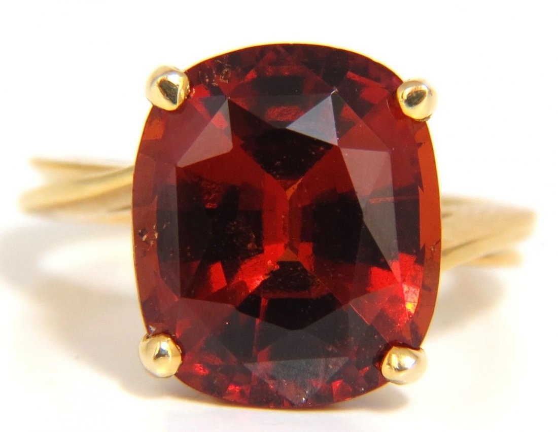 8.50CT NATURAL VIVID CRIMSON RED HESSONITE GARNET: 8.50ct. Natural Hessonite solitaire ring.Cushion cut Garnet, Clean ClarityBrilliant sparkles from all anglesPristine Transperency Classic Crimson Red13 X 11mmDepth of ring: 9.7mm14kt. yellow gold5 gra