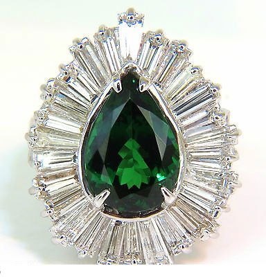 18KT 7.31CT NATURAL TOP GREEN TSAVORITE DIAMOND RING: 4.51ct. Natural Green Tsavorite GIA Certified report 2135721757 Stating: 12.76 X 8.68 X 5.74mm GIA: "Green" Supreme color, vivid and full of green sparkles VVS Very Clean Clarity Diamonds: 2.80ct. H-c